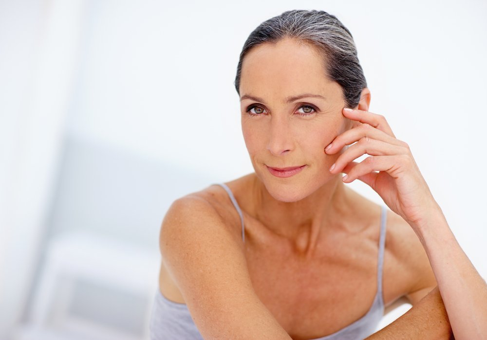 Portrait, skincare and woman with pride in studio with cosmetics, botox facial and dermatology treatment. Proud, mature female and beauty for wellness, natural glow and anti aging on white background