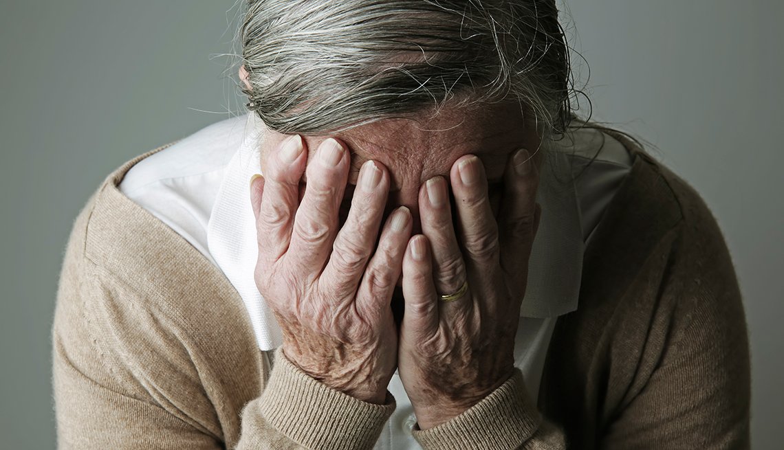 1140-alzheimer-myths-woman-hiding-face-esp